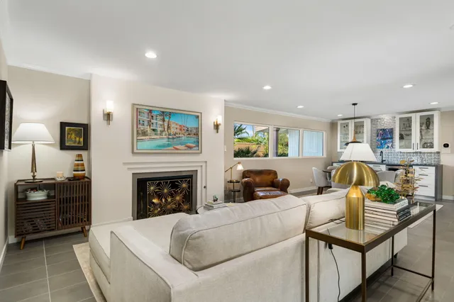 a living room with furniture gym equipment and a large window