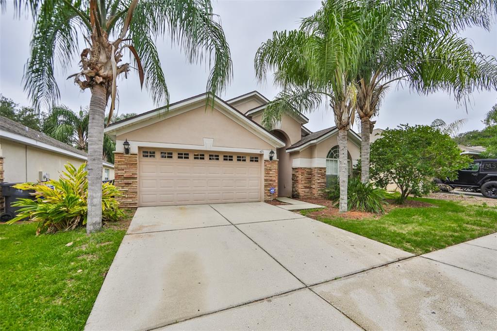 421 Thicket Crest Road Seffner, FL 33584 - Photo 1 of 1 a front view of a house with garden