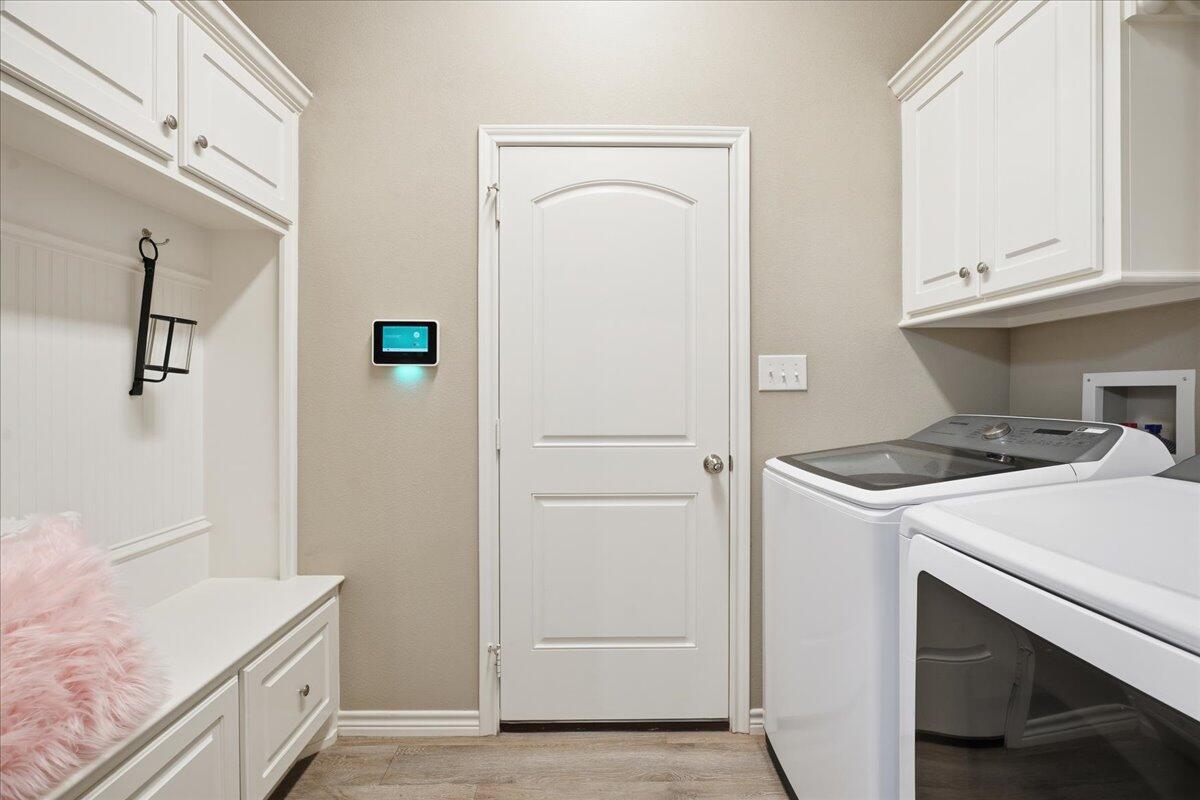 7612 59th Street Lubbock, TX 79407 - Photo 16 of 42 a kitchen with a stove and a refrigerator