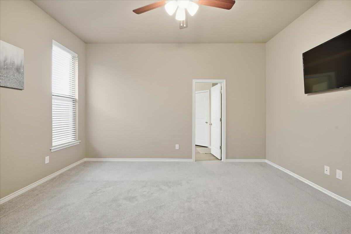 7612 59th Street Lubbock, TX 79407 - Photo 24 of 42 a view of an empty room with a window
