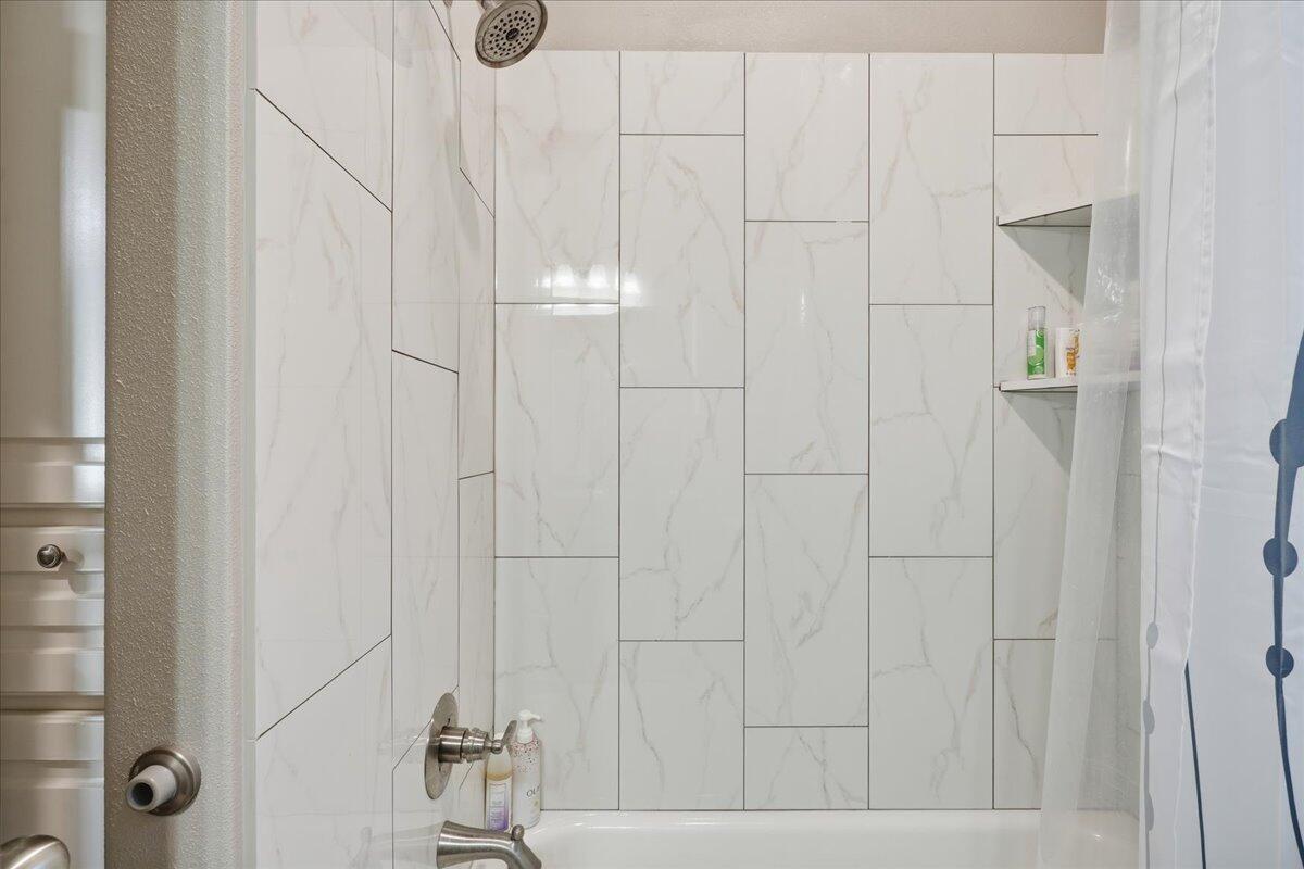 7612 59th Street Lubbock, TX 79407 - Photo 37 of 42 a bathroom with a shower