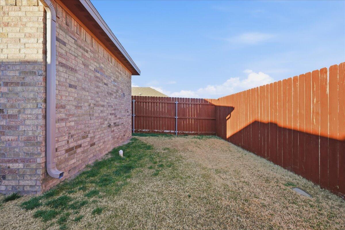 7612 59th Street Lubbock, TX 79407 - Photo 39 of 42 a view of backyard with potted plants