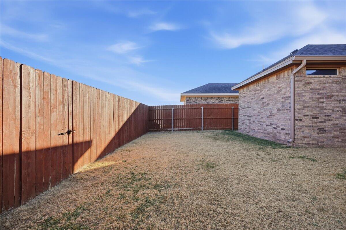 7612 59th Street Lubbock, TX 79407 - Photo 40 of 42 a view of backyard and wooden deck