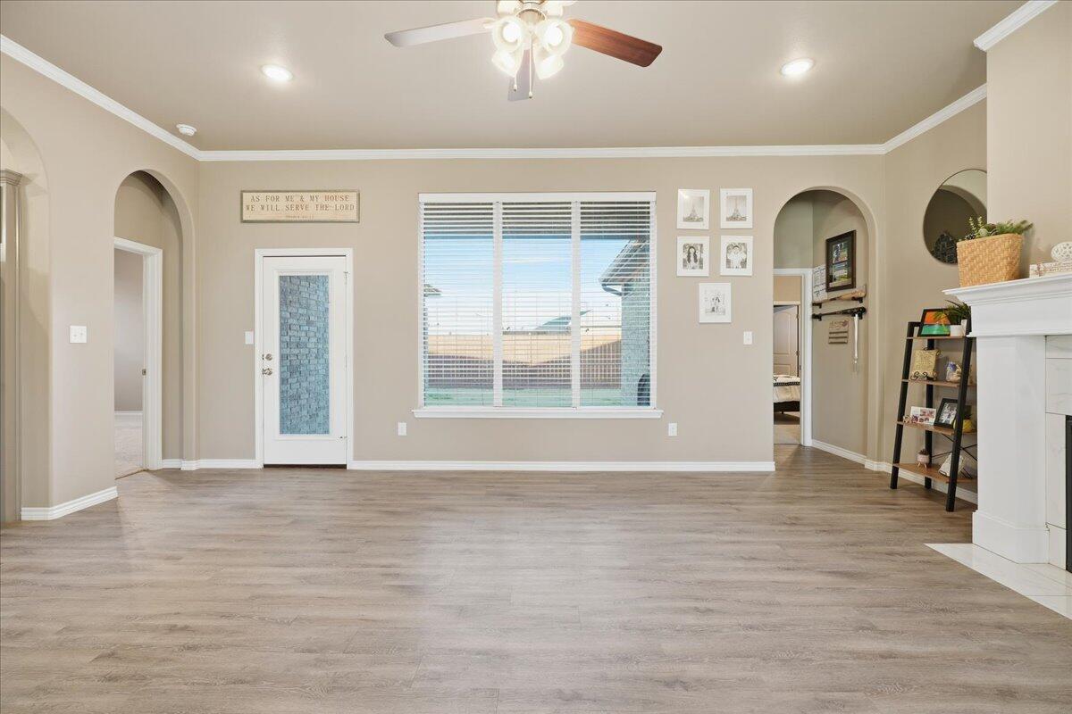 7612 59th Street Lubbock, TX 79407 - Photo 6 of 42 a view of livingroom with hardwood floor and a ceiling fan