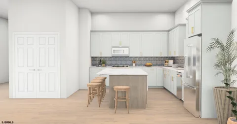 a kitchen with white cabinets and sink