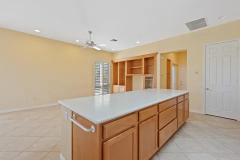 a room with a sink and chandelier