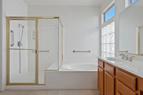 a bathroom with a bathtub and a sink