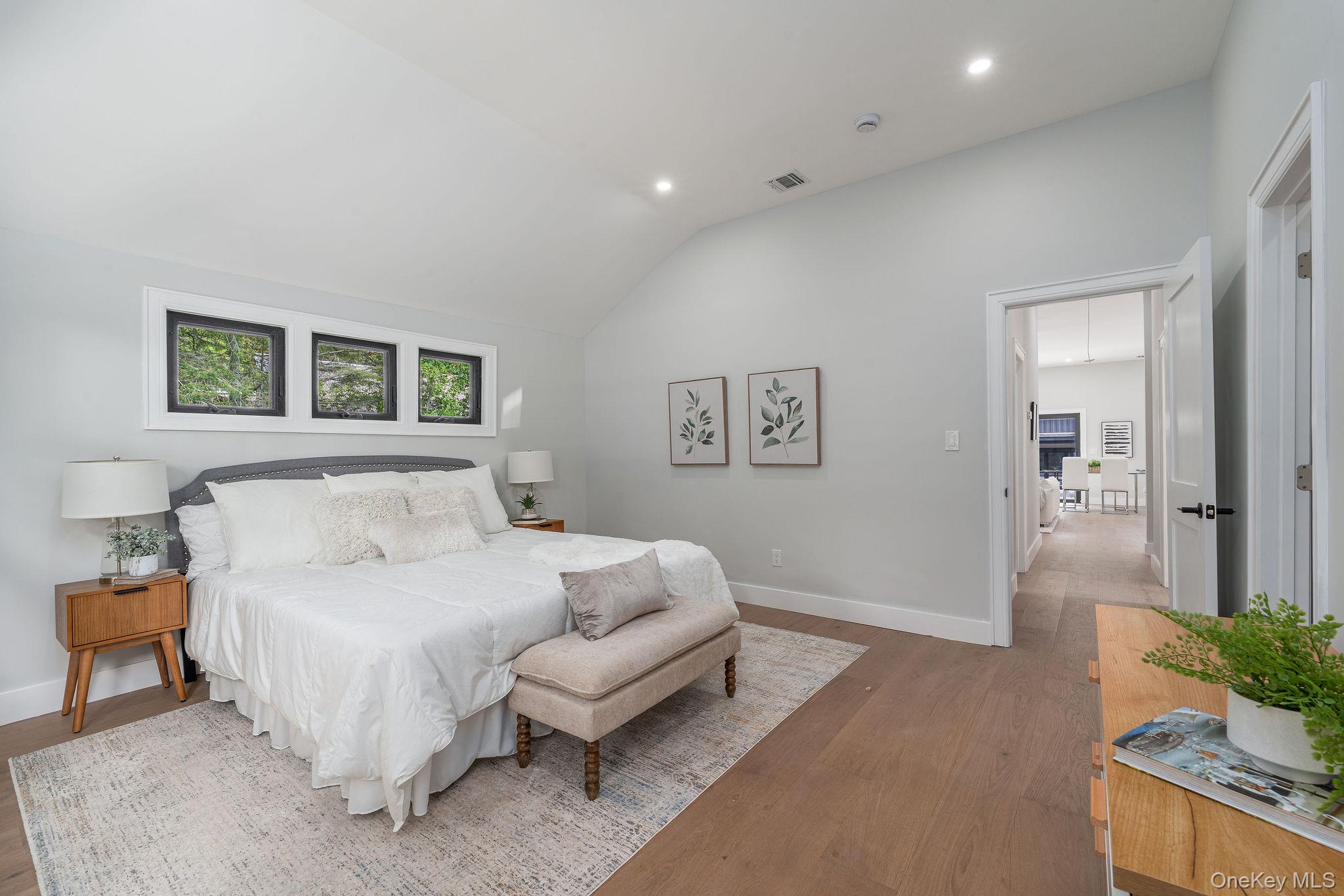 3420 Rocky Point Road East Marion, NY 11939 - Photo 14 of 34 Bedroom with vaulted ceiling, wood finished floors, and recessed lighting