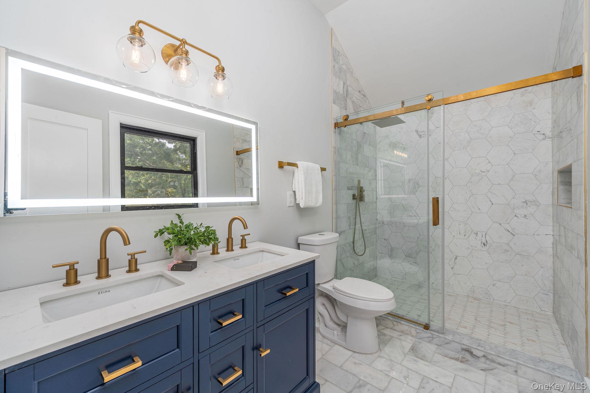 3420 Rocky Point Road East Marion, NY 11939 - Photo 16 of 34 Bathroom featuring a marble finish shower and double vanity