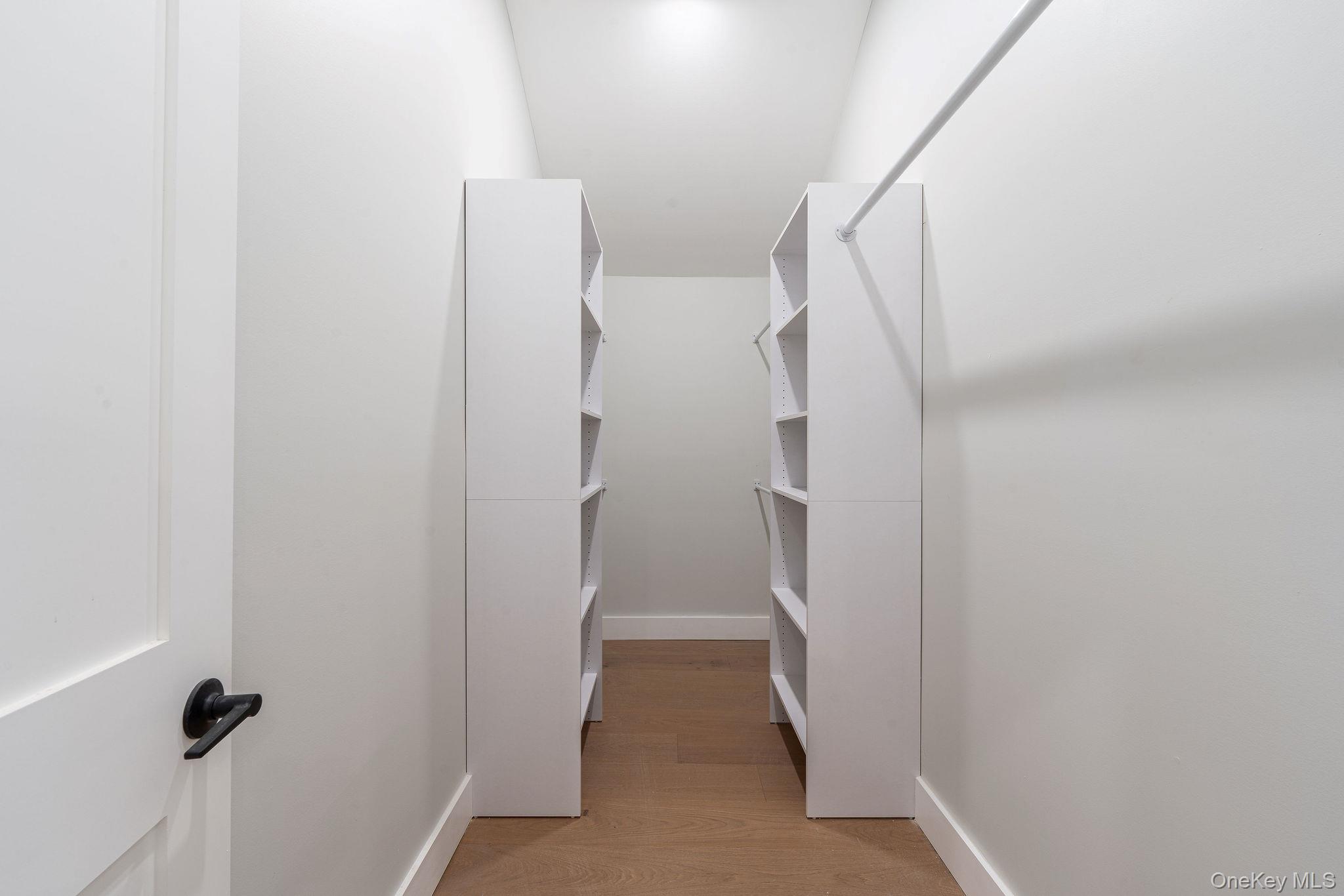 3420 Rocky Point Road East Marion, NY 11939 - Photo 18 of 34 Spacious closet with light wood-style flooring