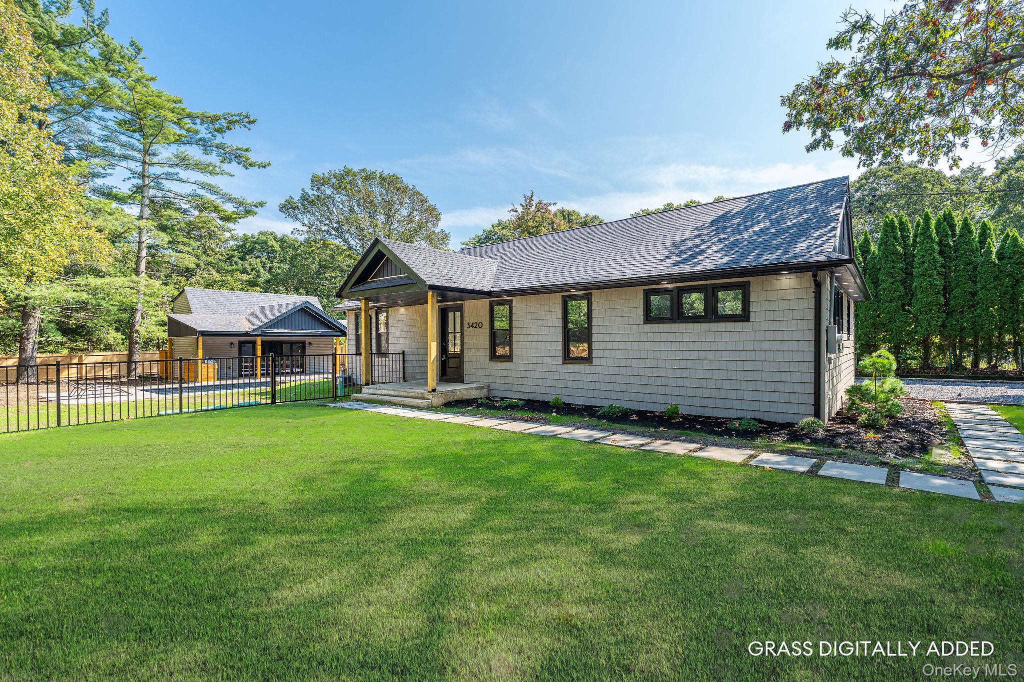 3420 Rocky Point Road East Marion, NY 11939 - Photo 2 of 34 View of front facade featuring a shingled roof and covered porch