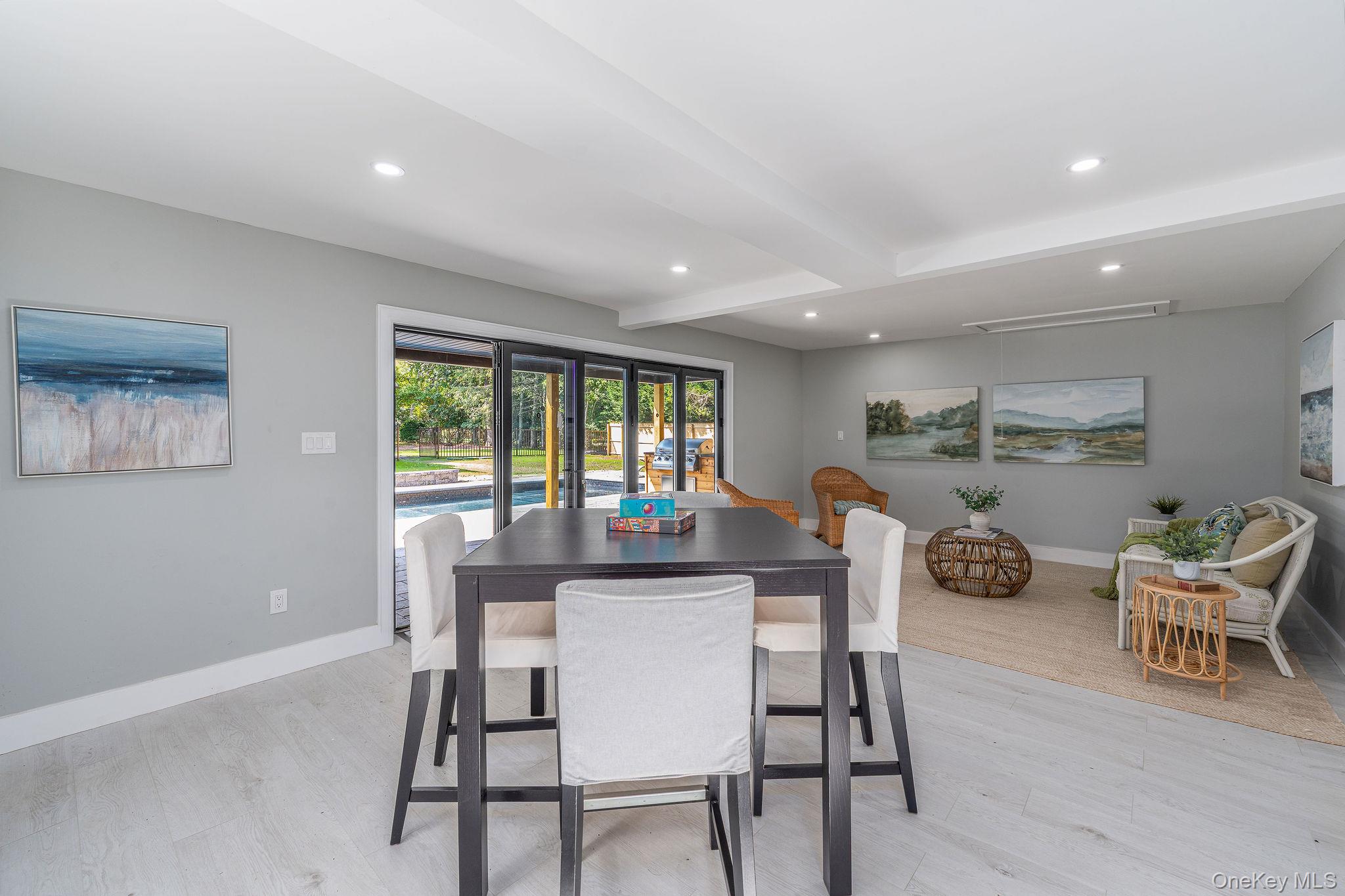 3420 Rocky Point Road East Marion, NY 11939 - Photo 23 of 34 Dining area with beam ceiling, recessed lighting, and light wood-style flooring