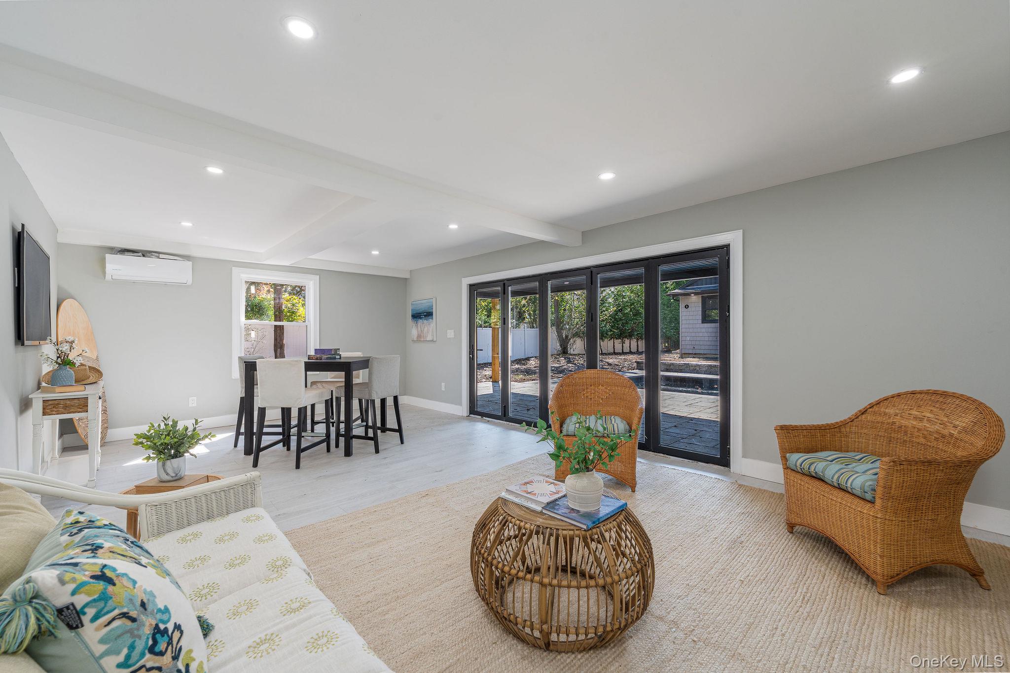 3420 Rocky Point Road East Marion, NY 11939 - Photo 24 of 34 Living area featuring beam ceiling, recessed lighting, and wood finished floors