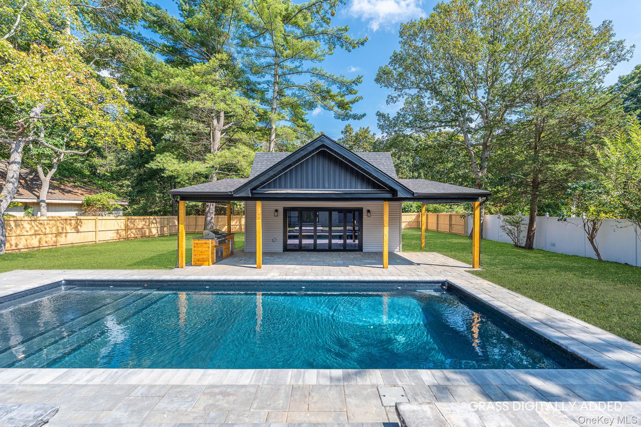 3420 Rocky Point Road East Marion, NY 11939 - Photo 27 of 34 View of pool featuring an exterior structure, a fenced backyard, an outbuilding, and a patio area