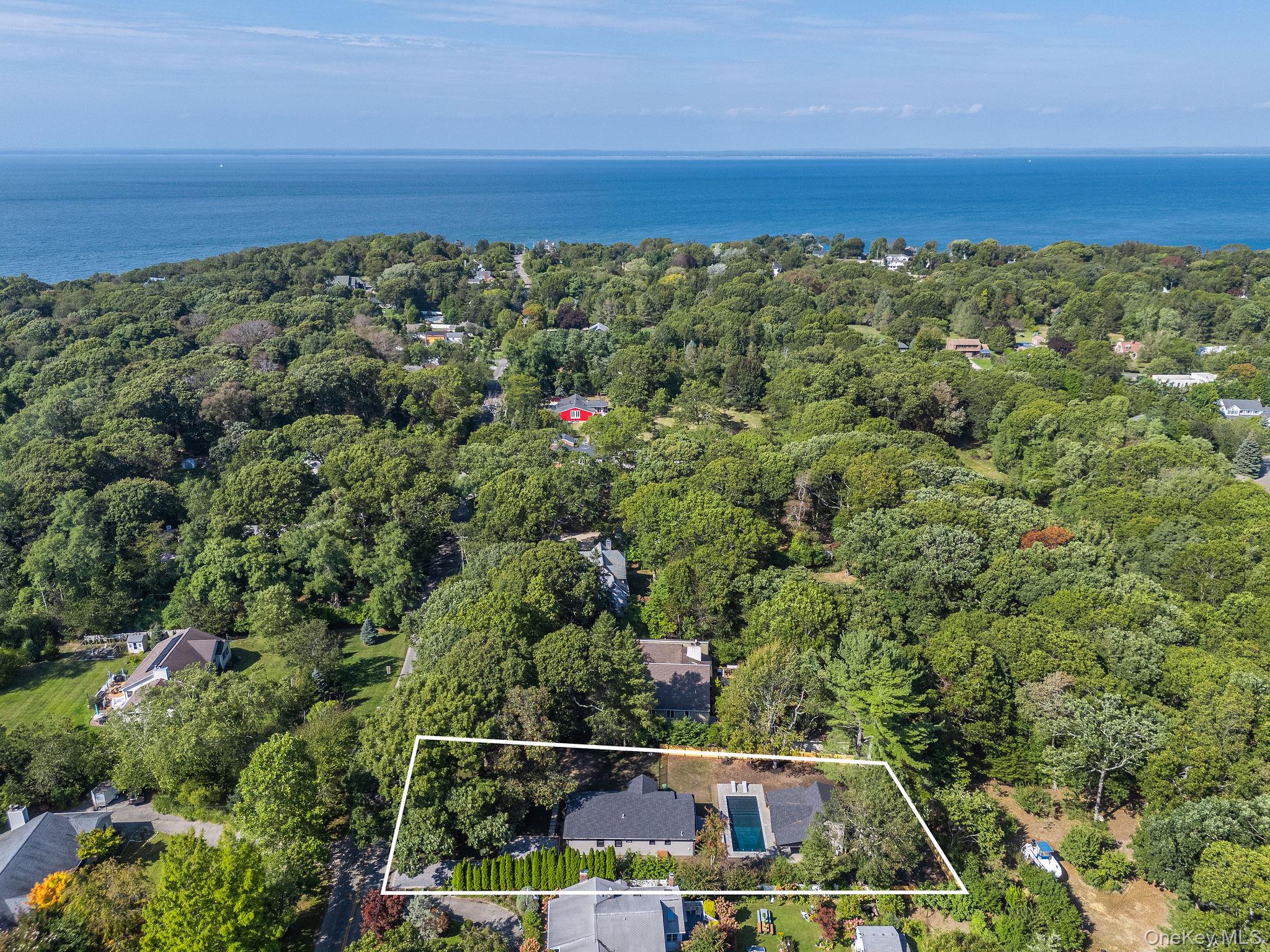 3420 Rocky Point Road East Marion, NY 11939 - Photo 33 of 34 Aerial overview of property's location with property boundaries highlighted and a large body of water