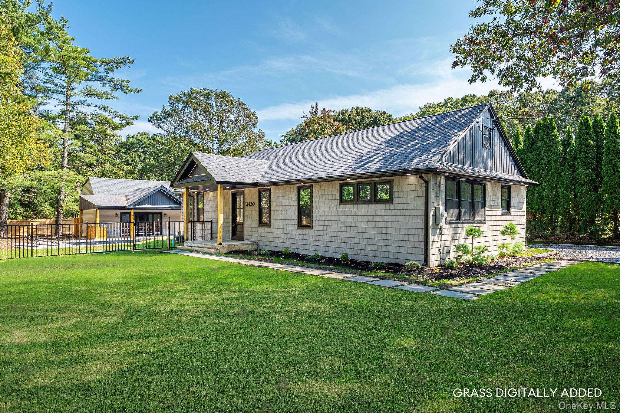 3420 Rocky Point Road East Marion, NY 11939 - Photo 34 of 34 View of front of property featuring roof with shingles and covered porch
