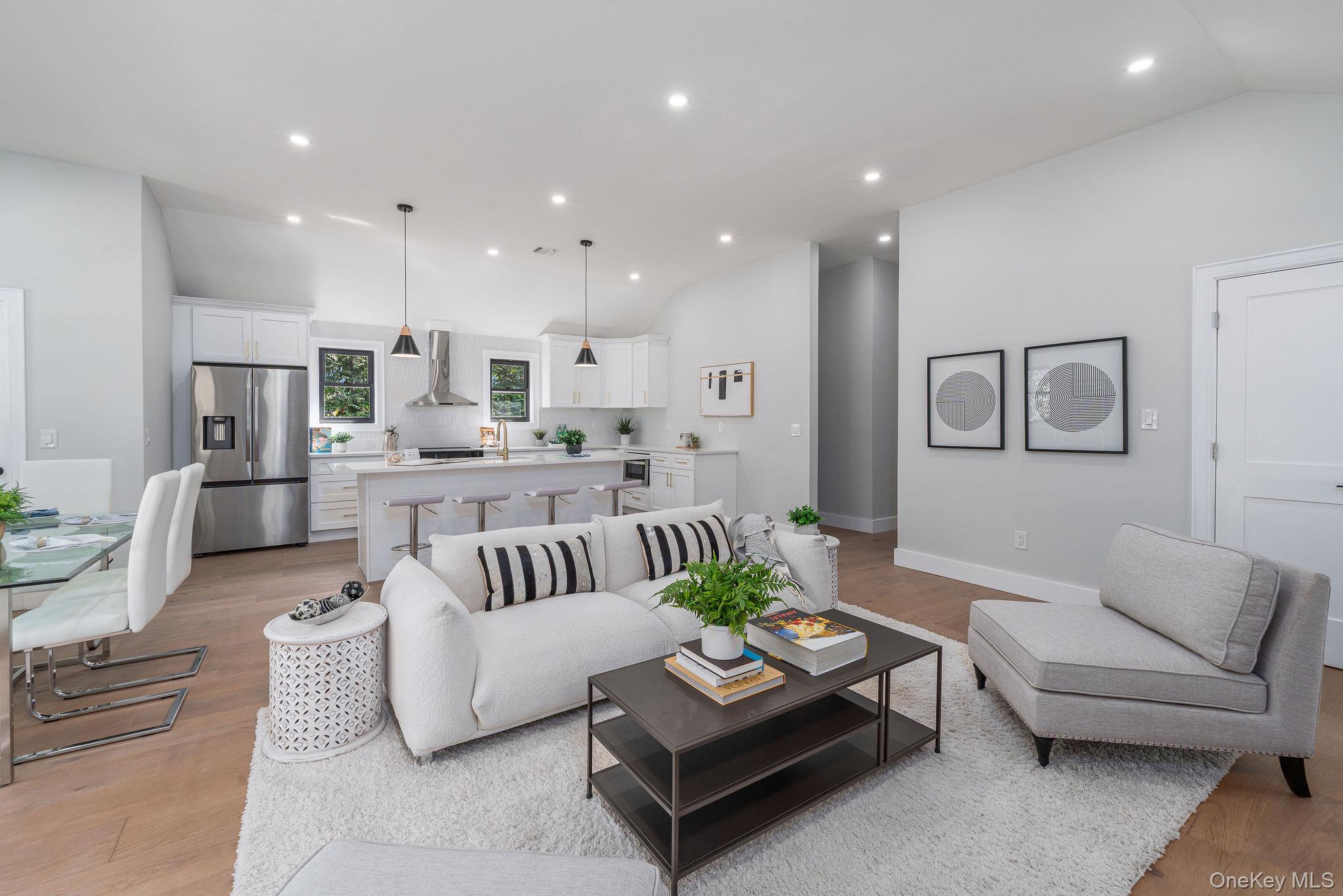 3420 Rocky Point Road East Marion, NY 11939 - Photo 6 of 34 Living area with vaulted ceiling, recessed lighting, and light wood finished floors