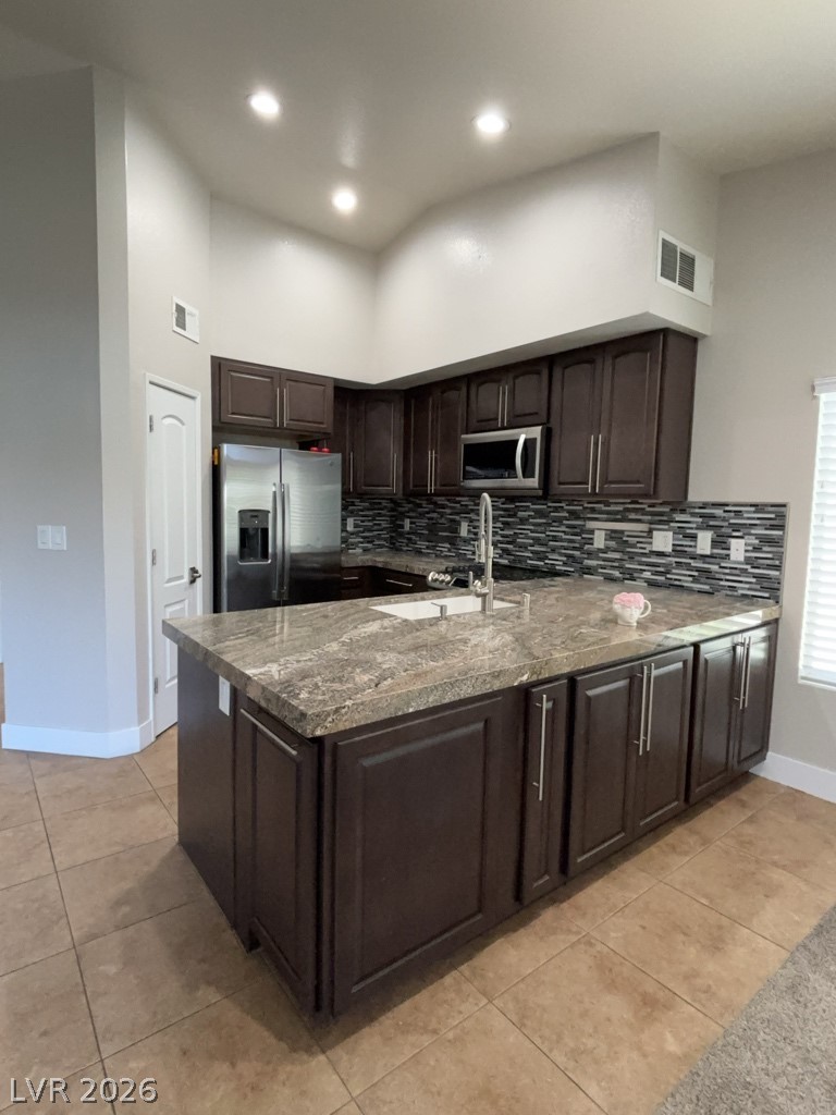 4810 Black Bear Road, Unit 201 Las Vegas, NV 89149 - Photo 4 of 9 Kitchen with granite countertops and stainless-steel appliances