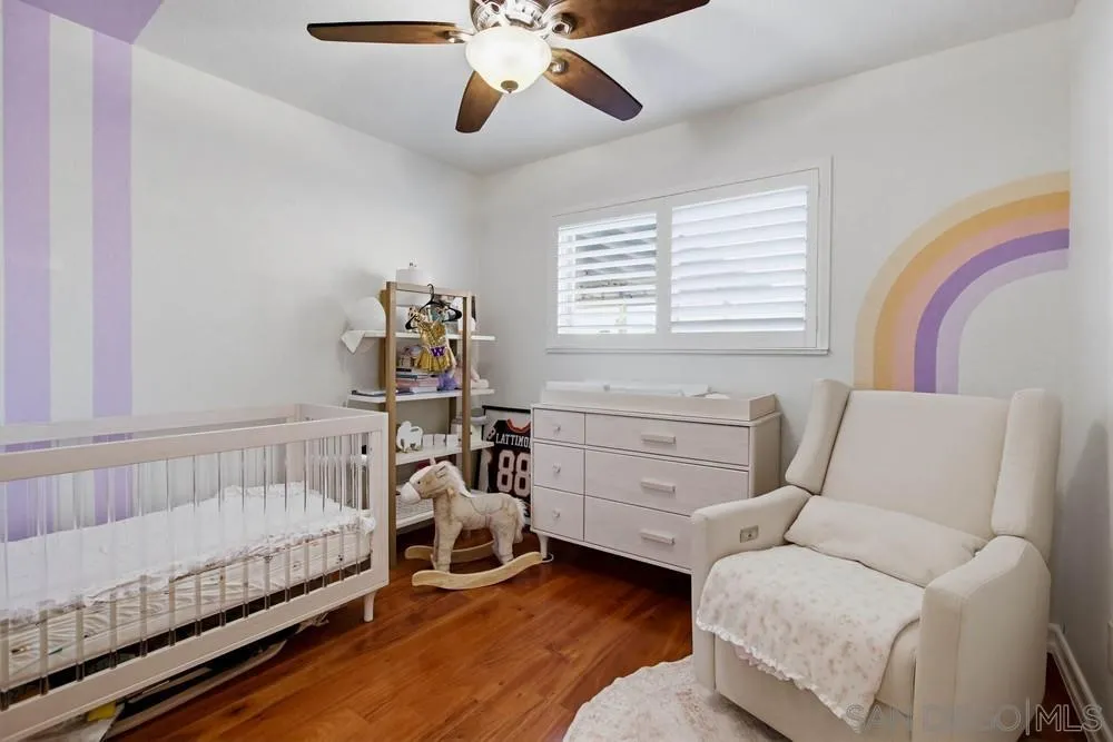 11038 Larkridge Street Santee, CA 92071 - Photo 18 of 44 a bedroom with furniture and a window