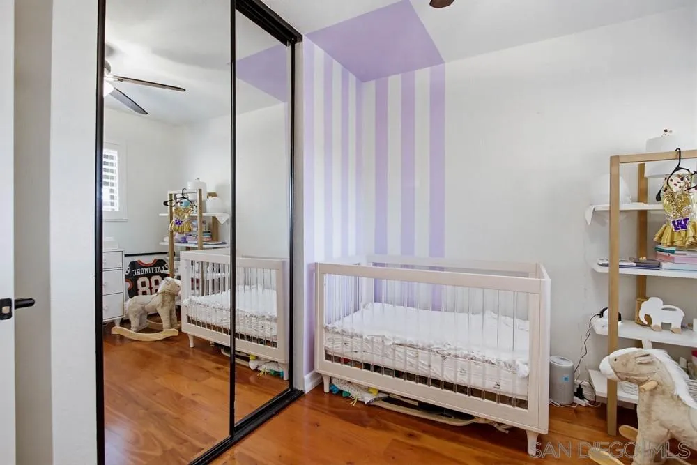 11038 Larkridge Street Santee, CA 92071 - Photo 19 of 44 a bedroom with a bed and a window