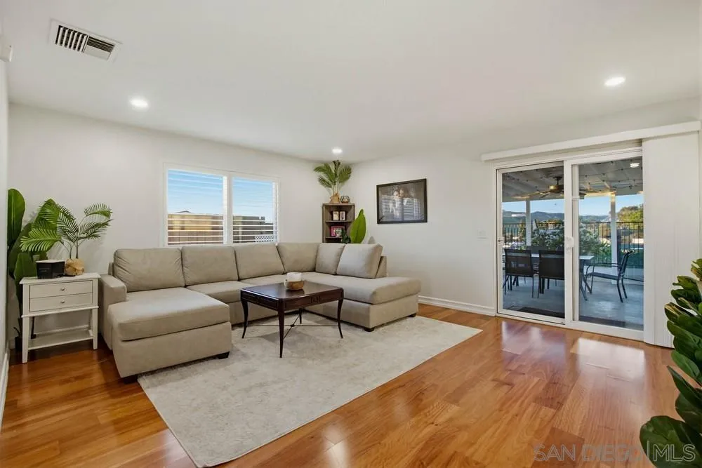 11038 Larkridge Street Santee, CA 92071 - Photo 3 of 44 a living room with furniture and wooden floor
