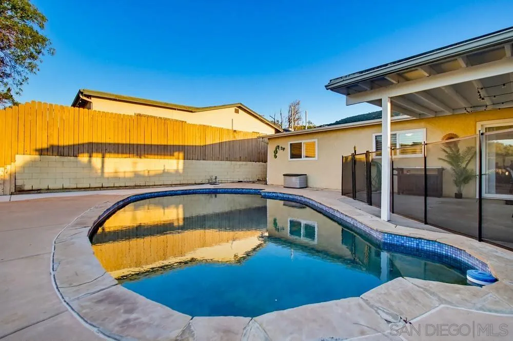 11038 Larkridge Street Santee, CA 92071 - Photo 37 of 44 a view of a swimming pool with a lounge chairs