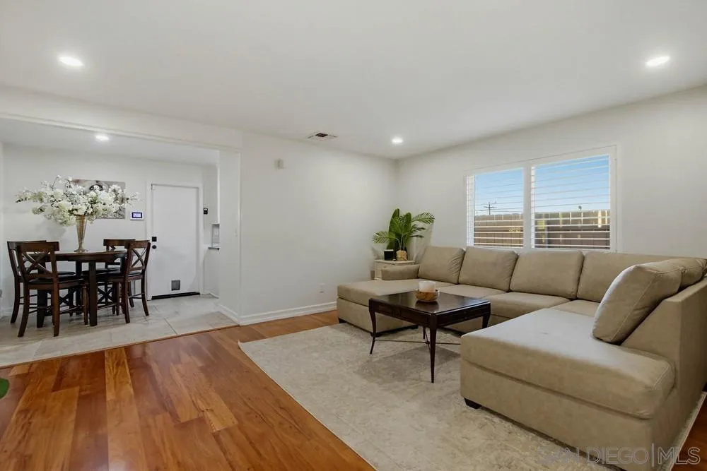 11038 Larkridge Street Santee, CA 92071 - Photo 6 of 44 a living room with furniture and wooden floor