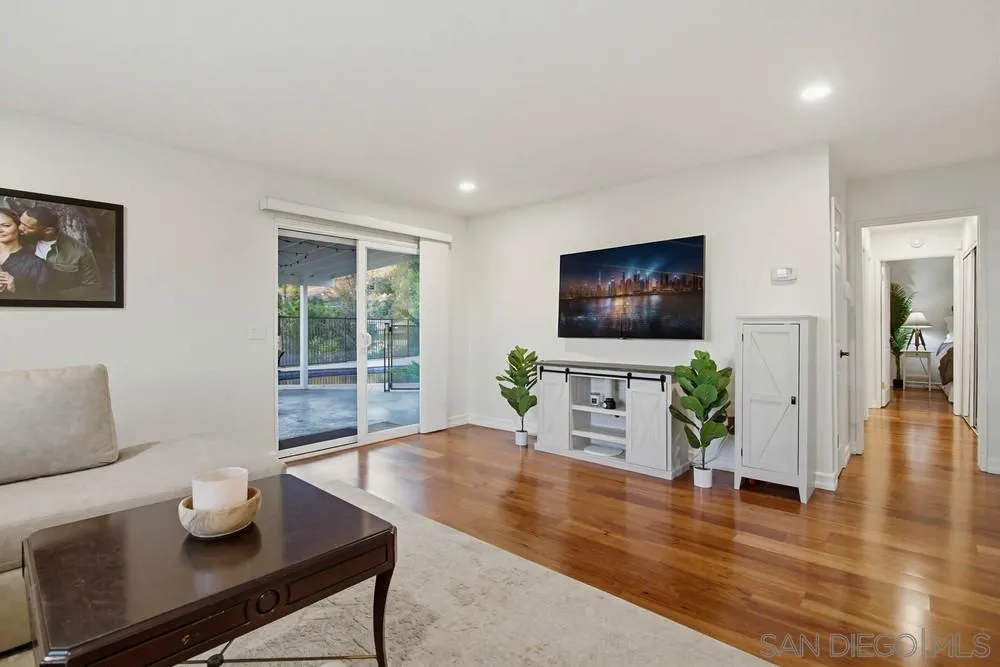 11038 Larkridge Street Santee, CA 92071 - Photo 8 of 44 a living room with furniture and a flat screen tv
