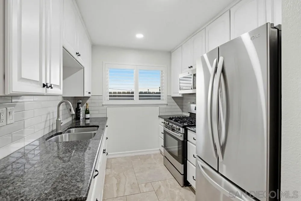 11038 Larkridge Street Santee, CA 92071 - Photo 10 of 44 a kitchen with stainless steel appliances granite countertop a refrigerator sink and stove