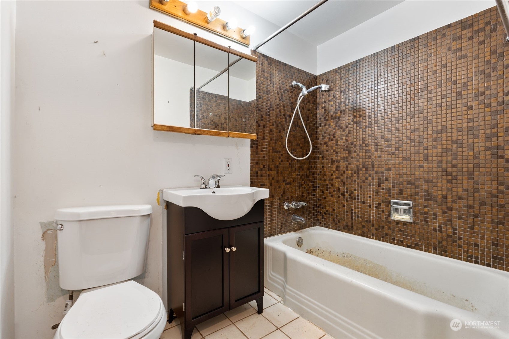 7634 South 112th Street Seattle, WA 98178 - Photo 13 of 26 a bathroom with a sink toilet and shower