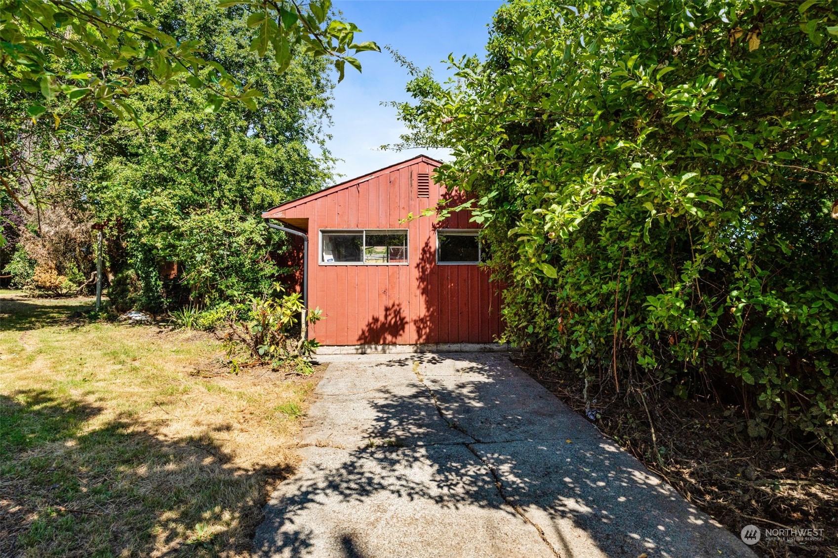7634 South 112th Street Seattle, WA 98178 - Photo 21 of 26 a view of a backyard with large trees