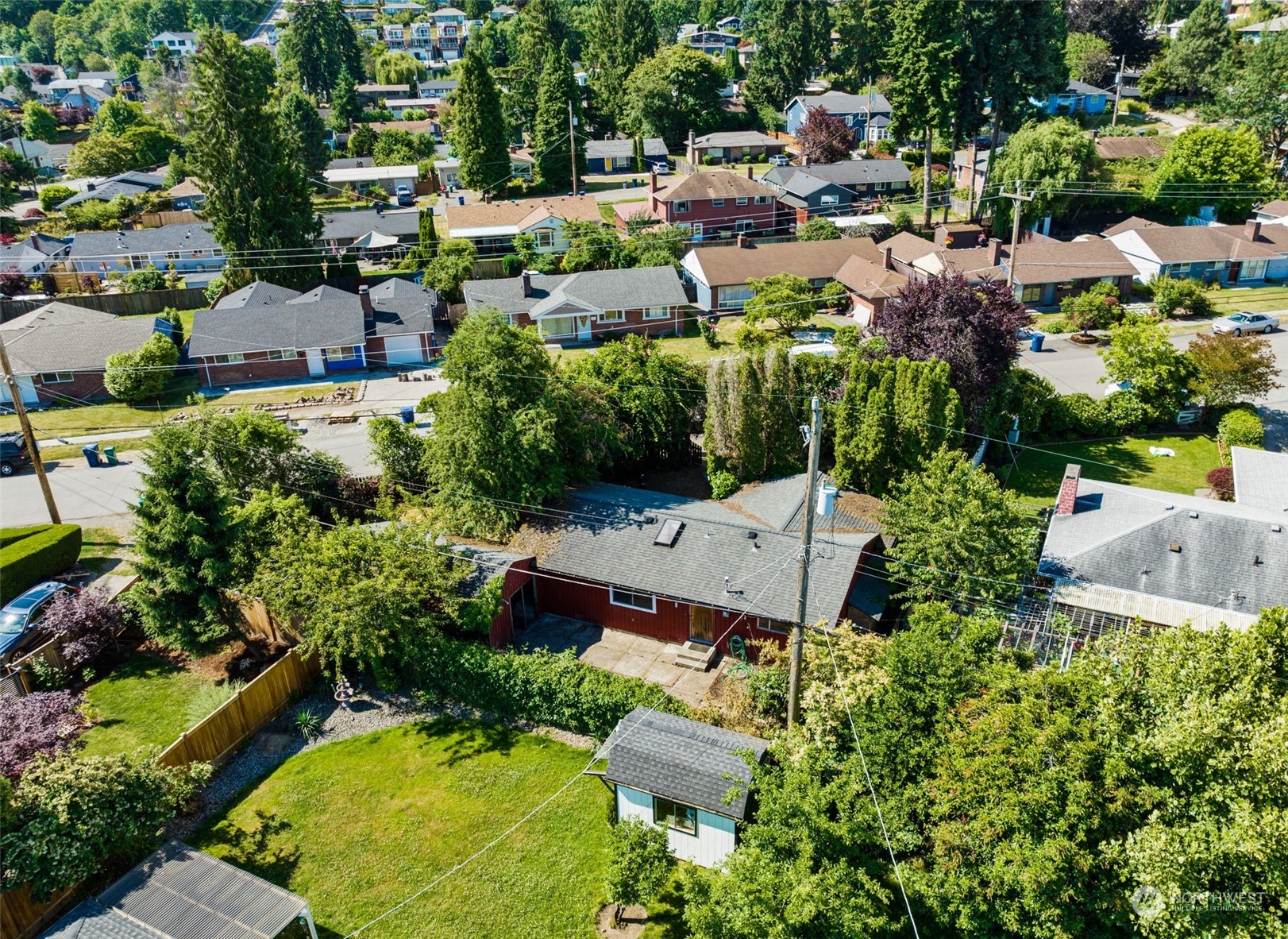 7634 South 112th Street Seattle, WA 98178 - Photo 23 of 26 an aerial view of a house with yard swimming pool and outdoor seating