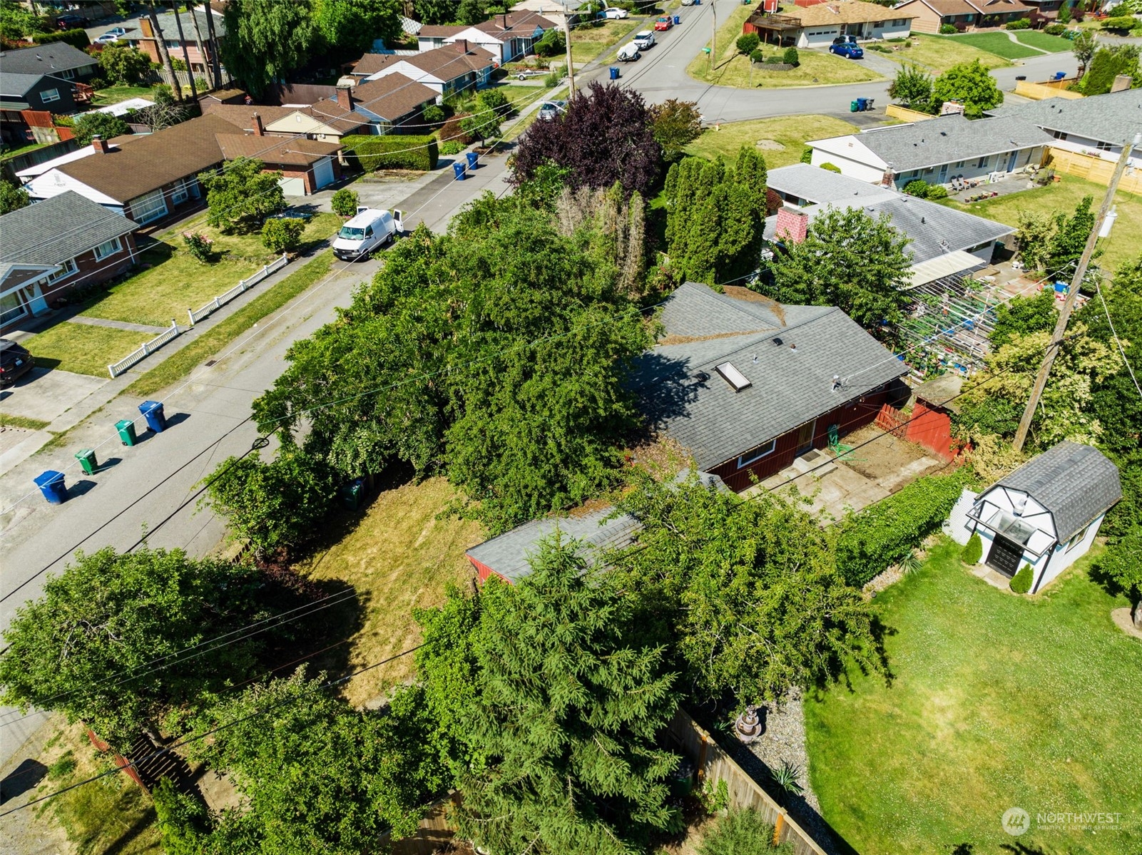 7634 South 112th Street Seattle, WA 98178 - Photo 24 of 26 an aerial view of residential house with outdoor space and trees all around