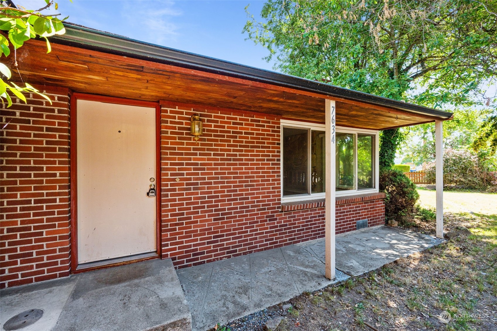 7634 South 112th Street Seattle, WA 98178 - Photo 3 of 26 a view of a house with backyard and sitting area