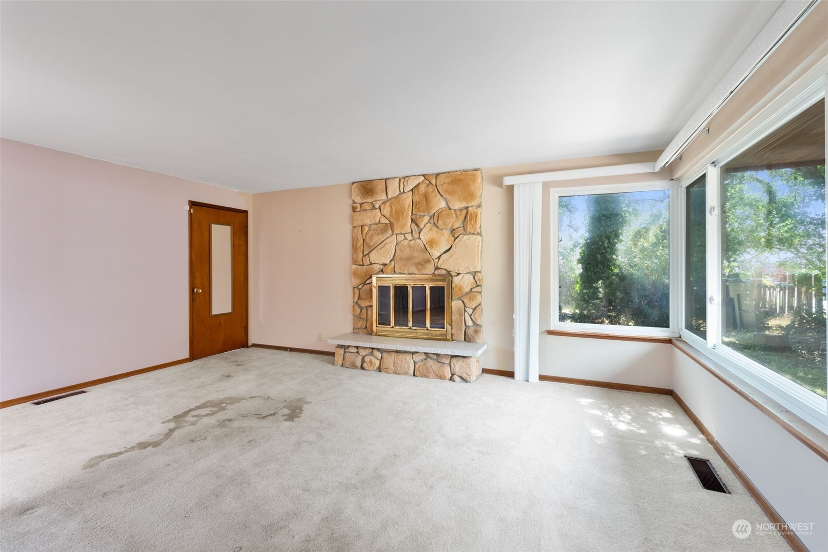 7634 South 112th Street Seattle, WA 98178 - Photo 5 of 26 a view of an empty room with a window