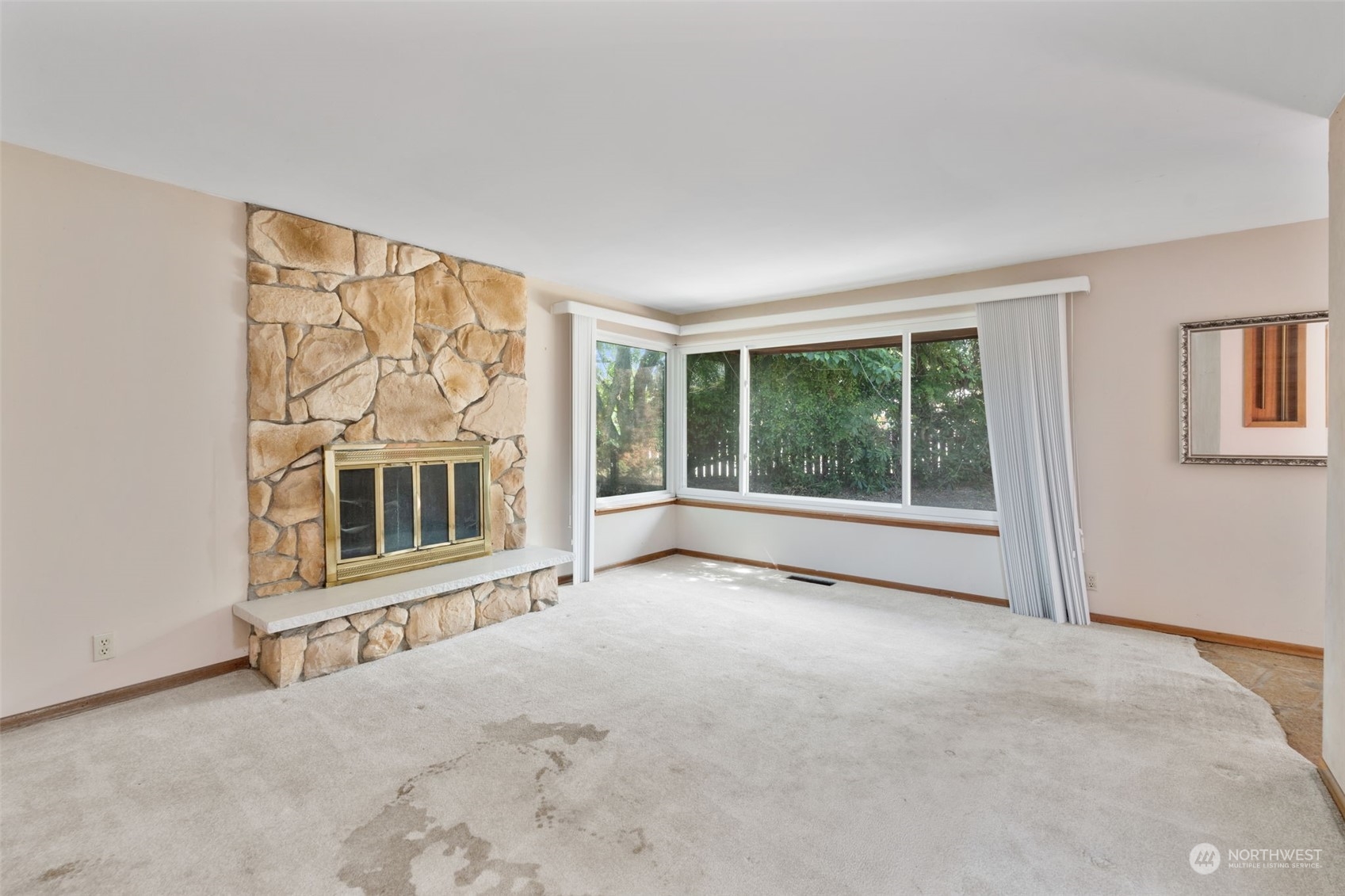 7634 South 112th Street Seattle, WA 98178 - Photo 6 of 26 a view of an empty room with a window