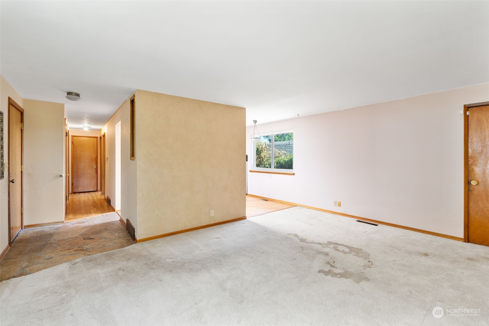 7634 South 112th Street Seattle, WA 98178 - Photo 8 of 26 a view of an empty room and a window