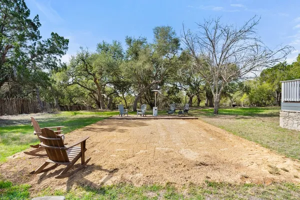 a view of a park with large trees