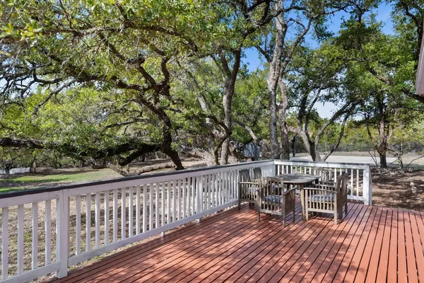 a view of balcony with wooden floor and outdoor seating