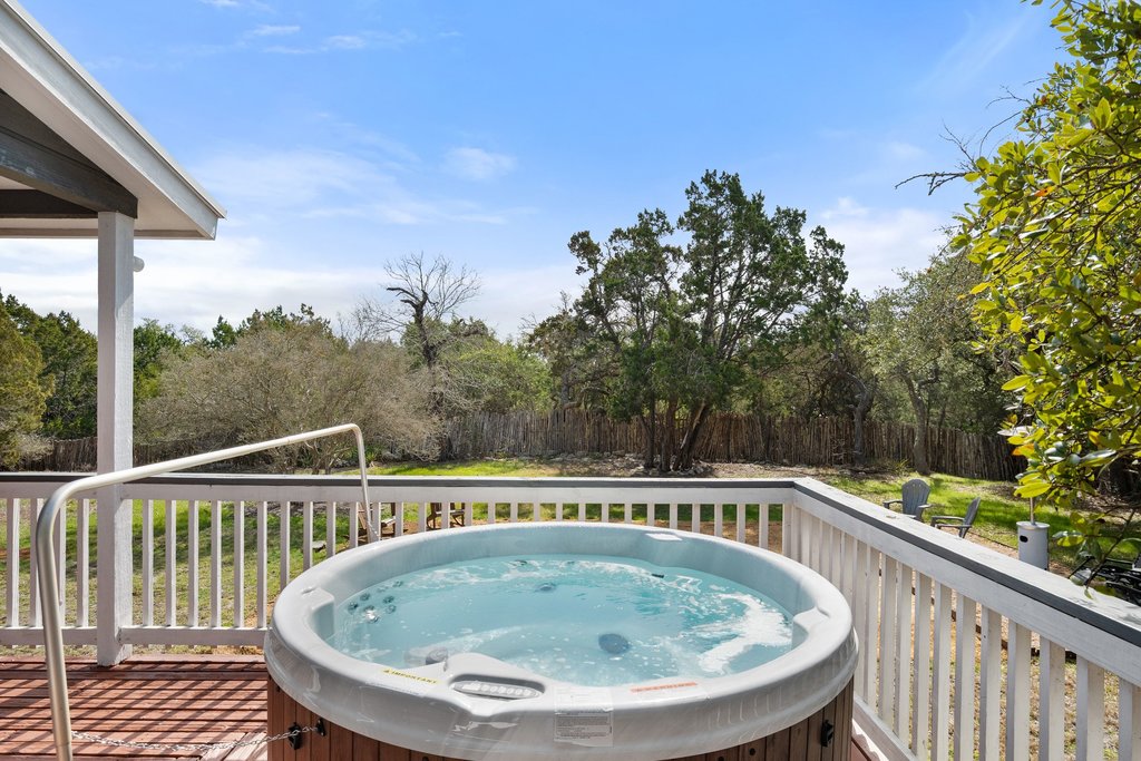 201 Raincloud Road Wimberley, TX 78676 - Photo 4 of 40 Wooden deck with a hot tub