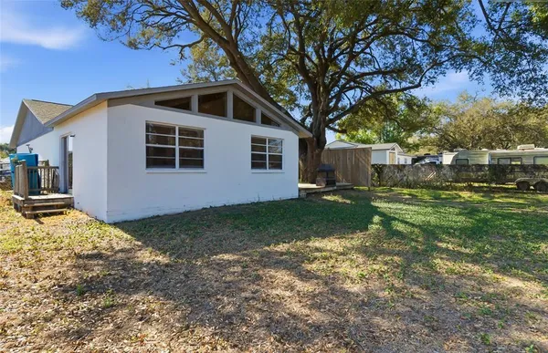 a backyard of a house with lots of green space