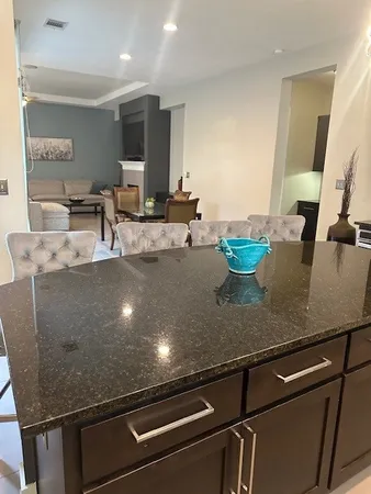 a kitchen with a stove and a refrigerator