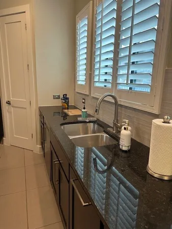 a kitchen with sink and window