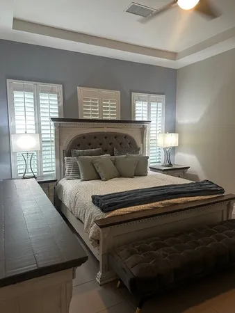 a bedroom with a bed and window