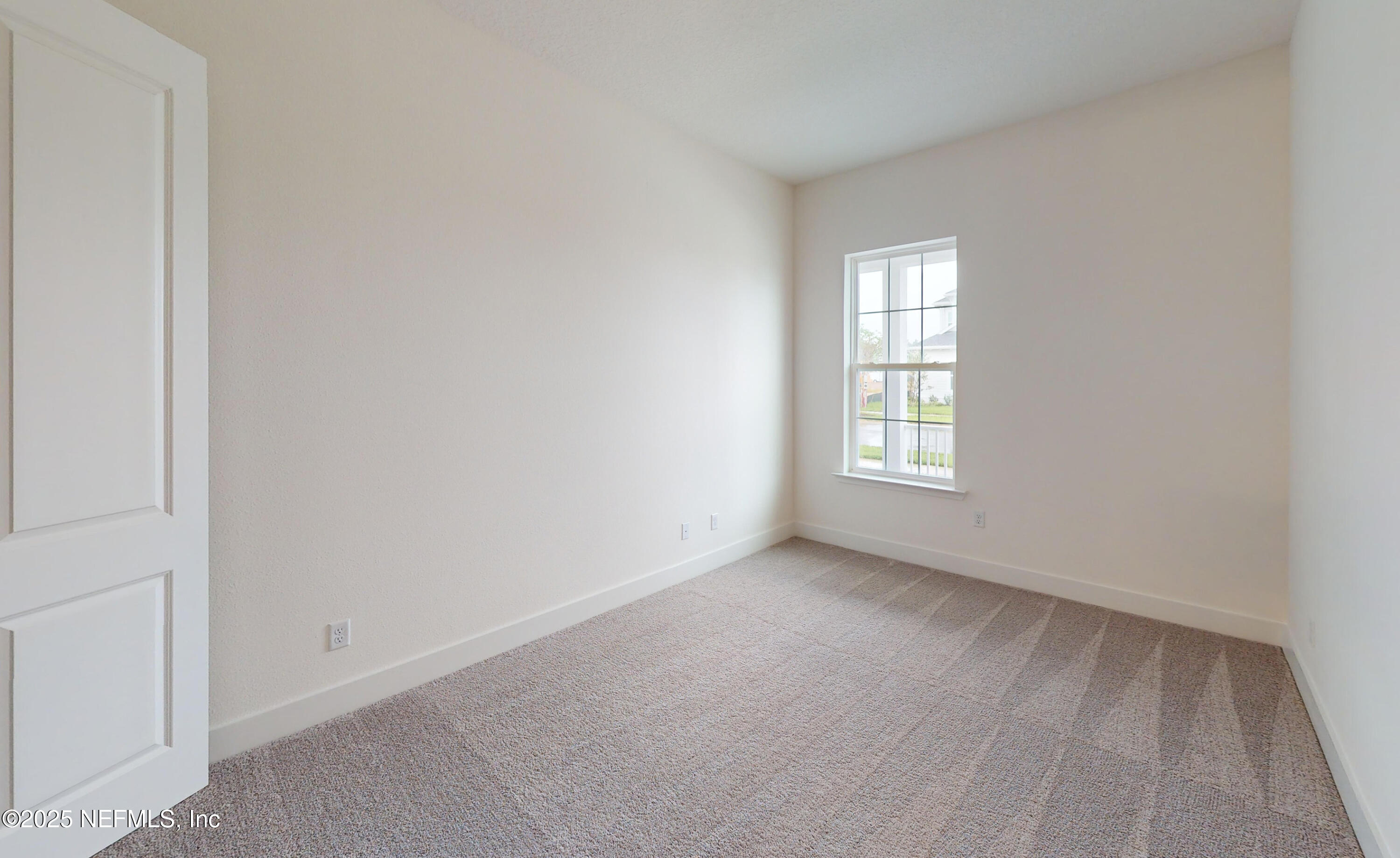 5541 Rainbarrel Road Jacksonville, FL 32224 - Photo 16 of 23 a view of an empty room with a window
