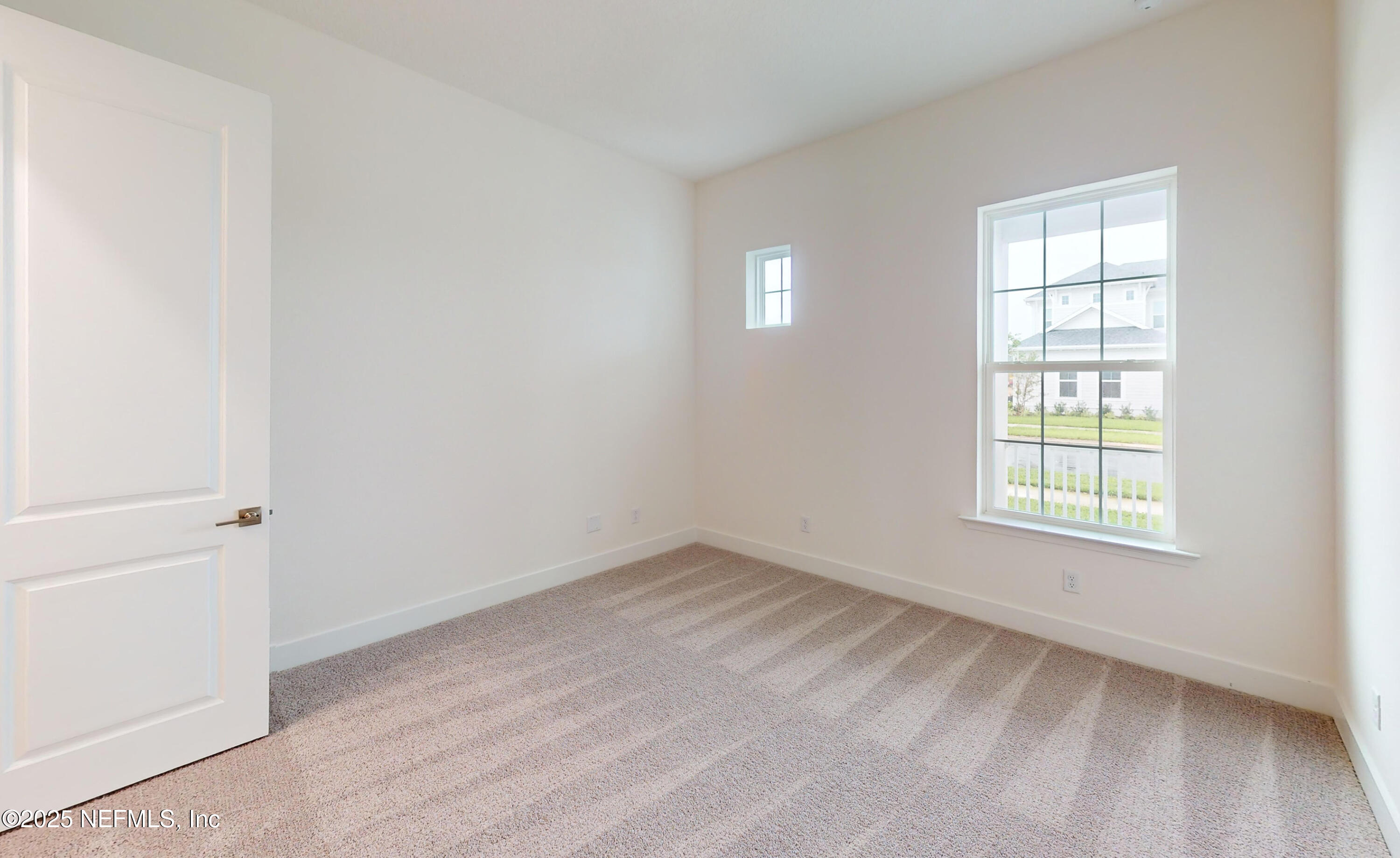 5541 Rainbarrel Road Jacksonville, FL 32224 - Photo 18 of 23 an empty room with a window