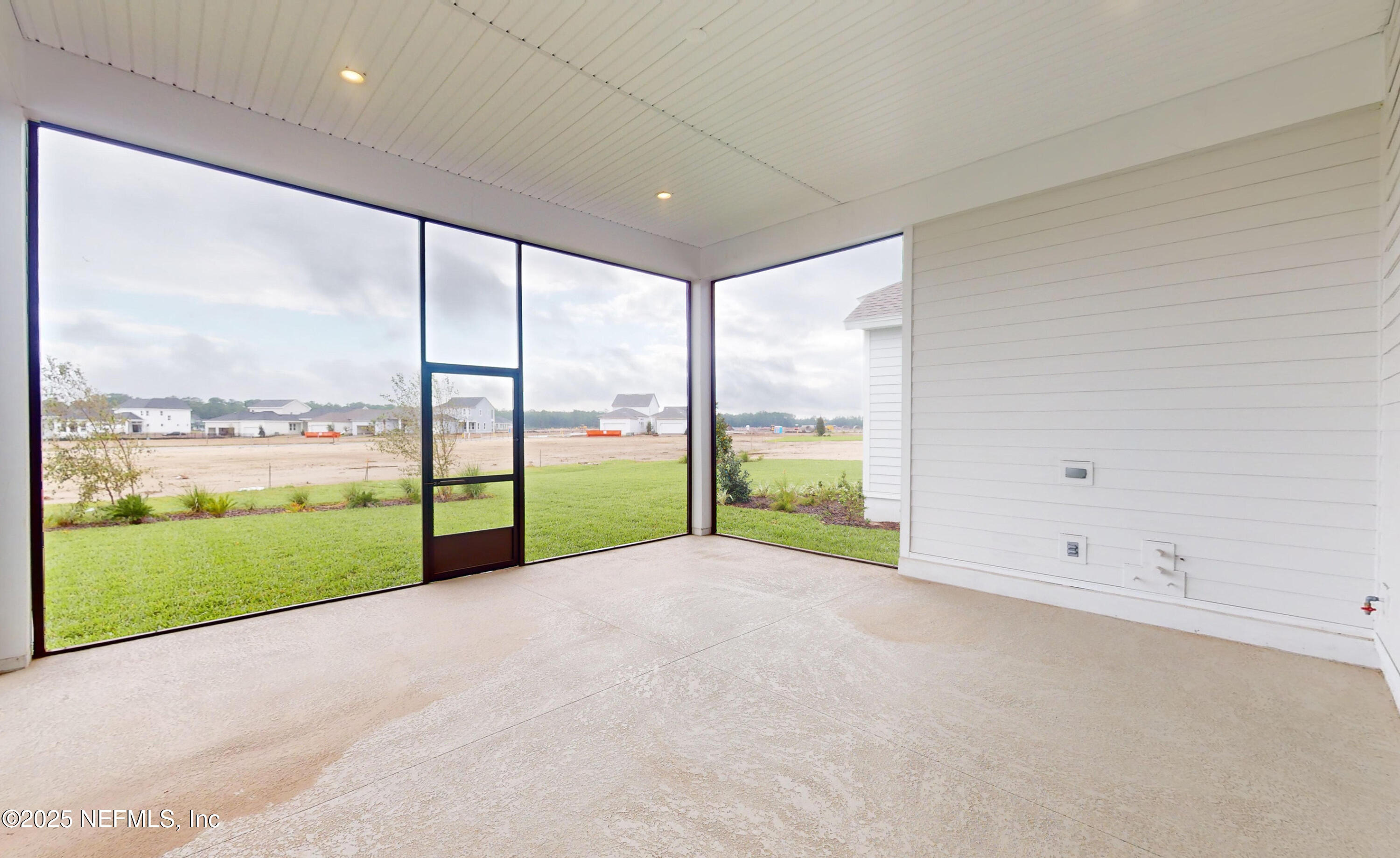 5541 Rainbarrel Road Jacksonville, FL 32224 - Photo 22 of 23 a view of an empty room with a large window