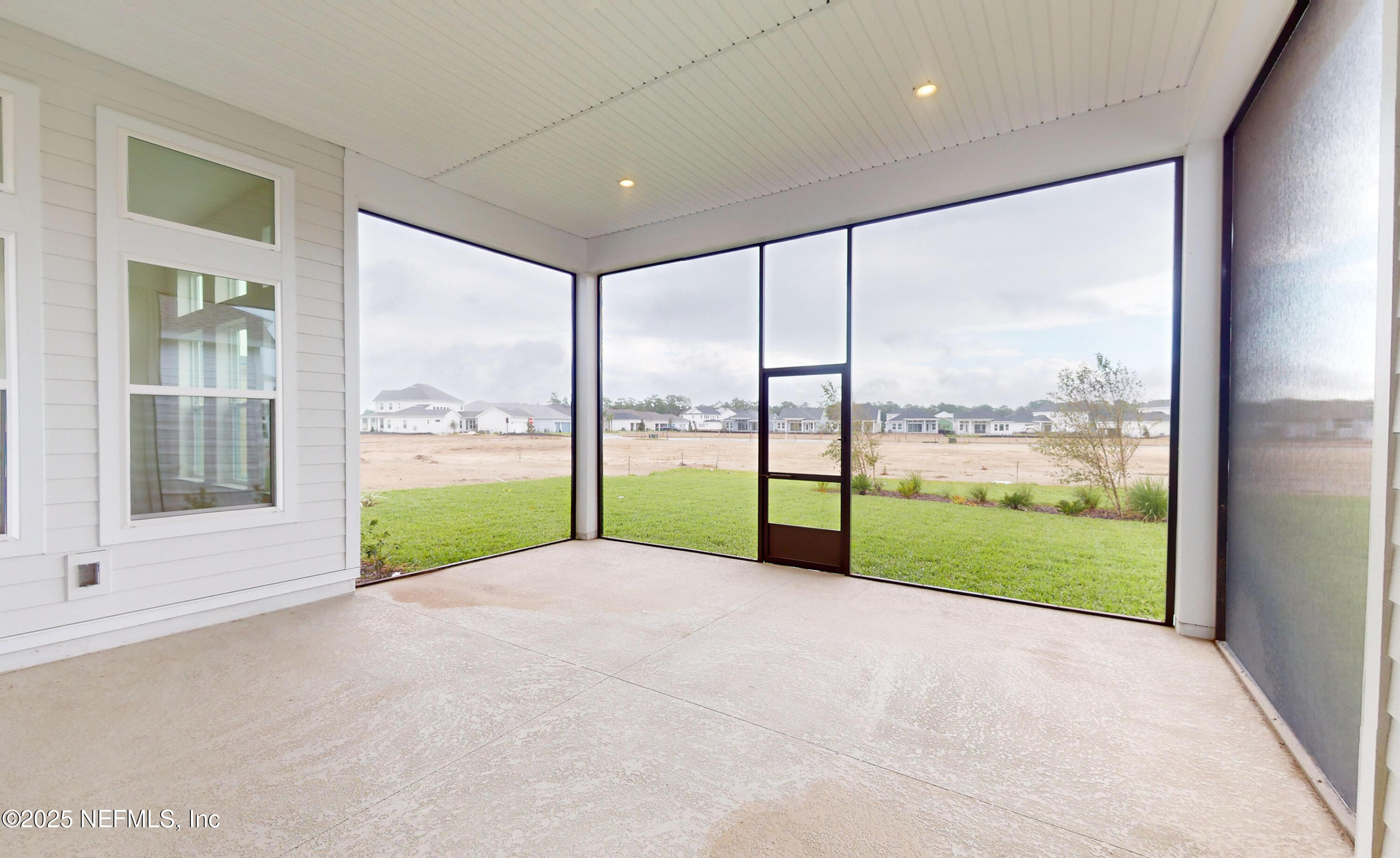 5541 Rainbarrel Road Jacksonville, FL 32224 - Photo 23 of 23 a view of an empty room with a large window