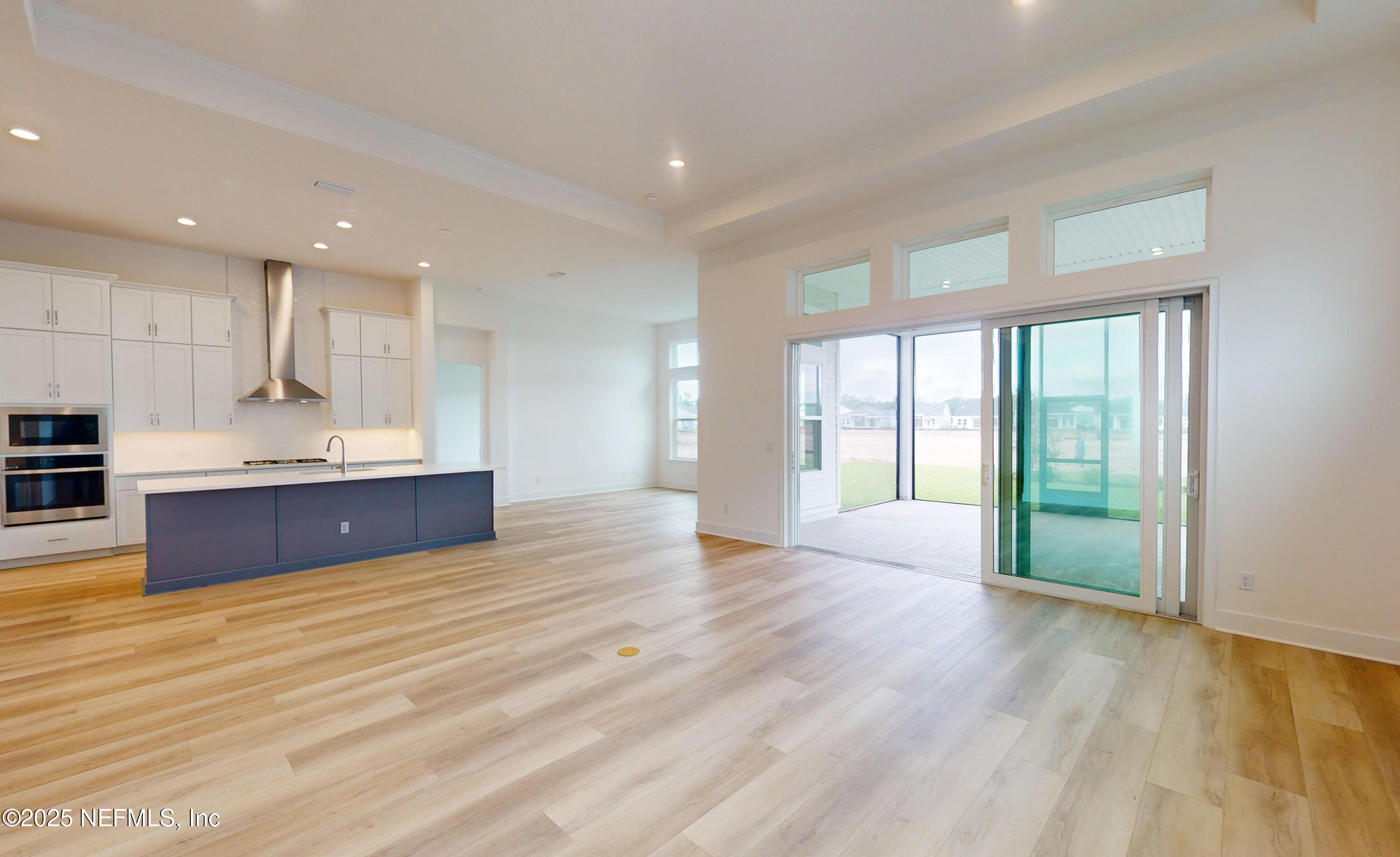 5541 Rainbarrel Road Jacksonville, FL 32224 - Photo 7 of 23 a view of kitchen with wooden floor and electronic appliances