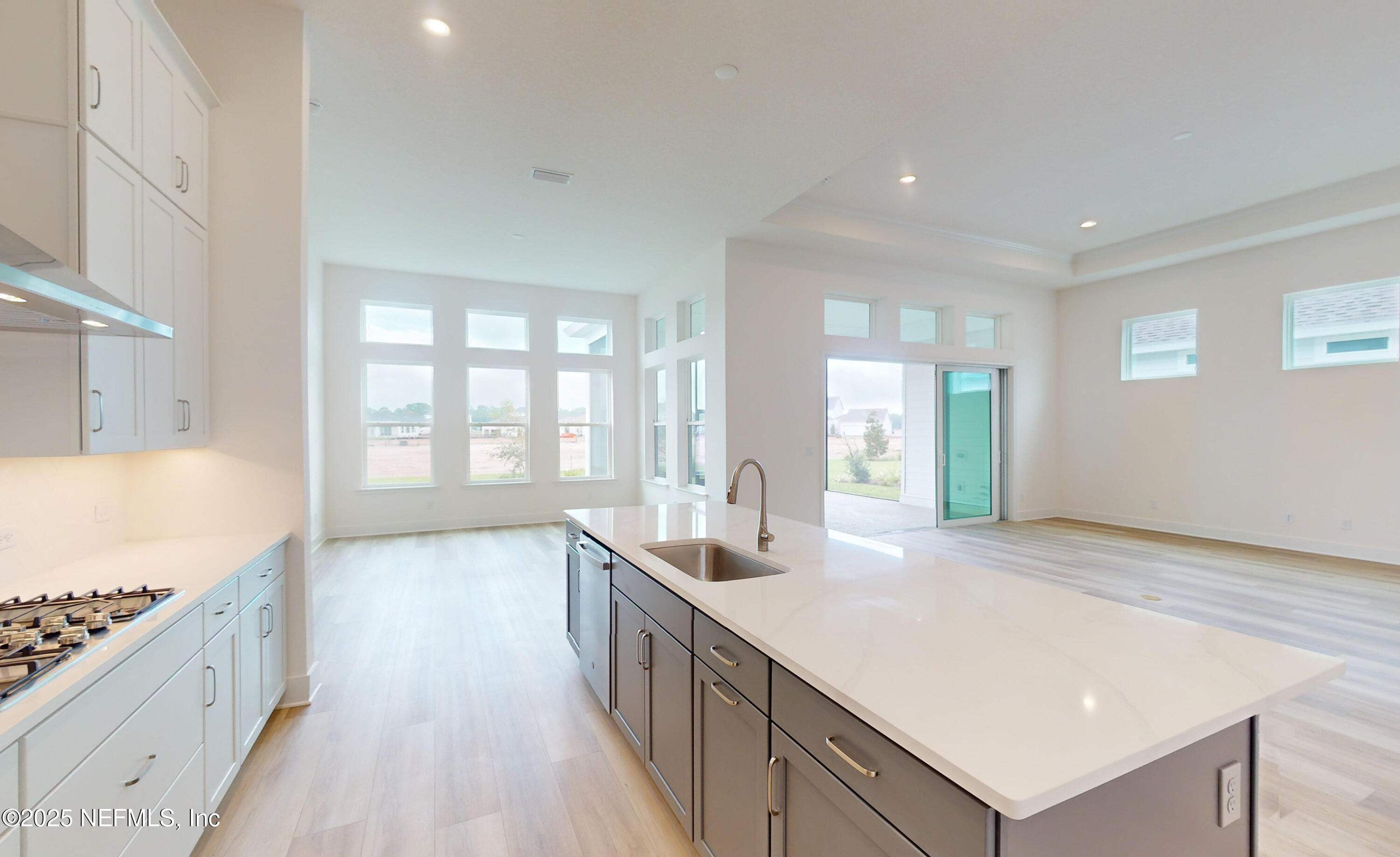 5541 Rainbarrel Road Jacksonville, FL 32224 - Photo 8 of 23 a large white kitchen with a large window